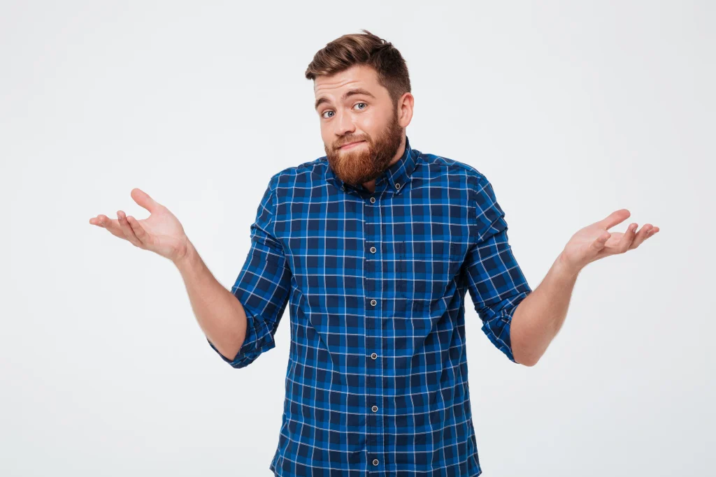 Confused man wondering how to remove mold from bathroom.