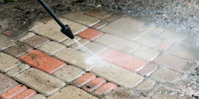 Driveway cleaning in Melbourne using professional pressure washing techniques to remove stains, moss, and dirt.