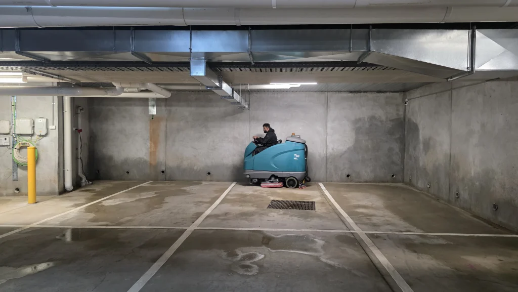 Graffiti removal service in Melbourne pressure washing a commercial wall with pressure washing equipment
